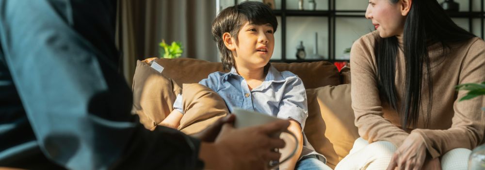 Family talking together at home, representing bonding, communication and stronger family connection