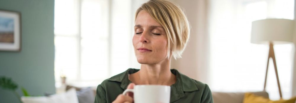 Woman relaxing at home, representing calm and emotional wellbeing during the fertility journey