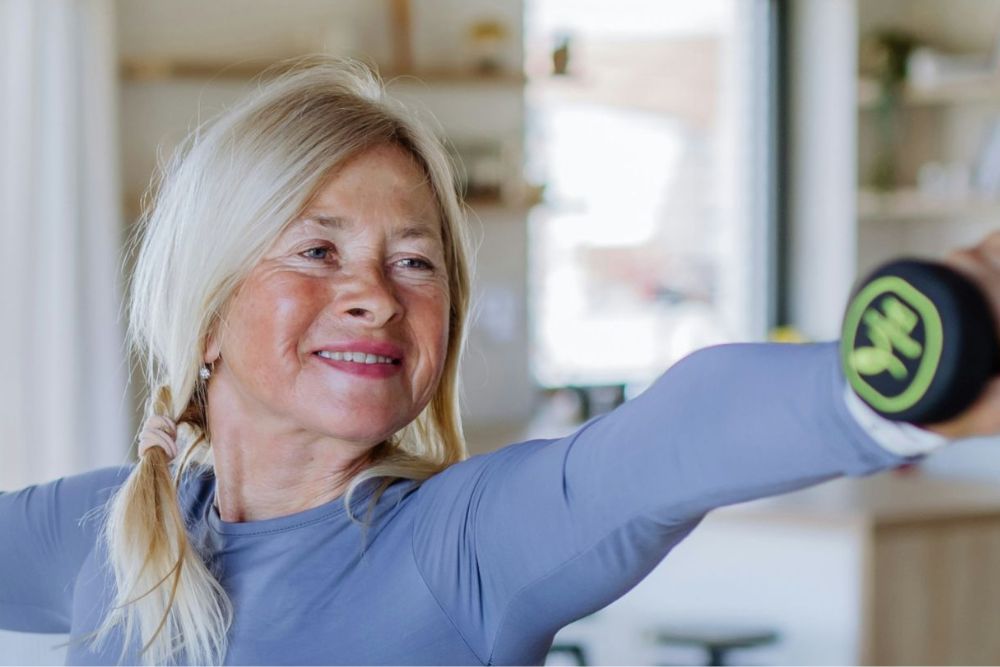 Woman exercising at home, representing resilience, recovery and moving forward after trauma
