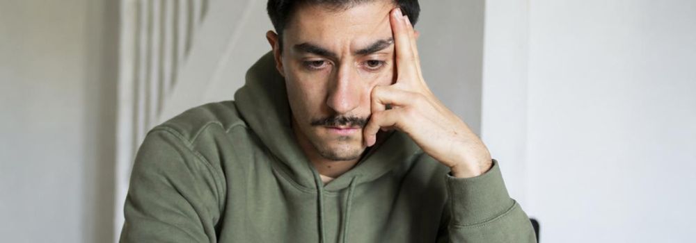 Veteran reflecting on difficult emotions, representing emotional processing and greater self-regulation